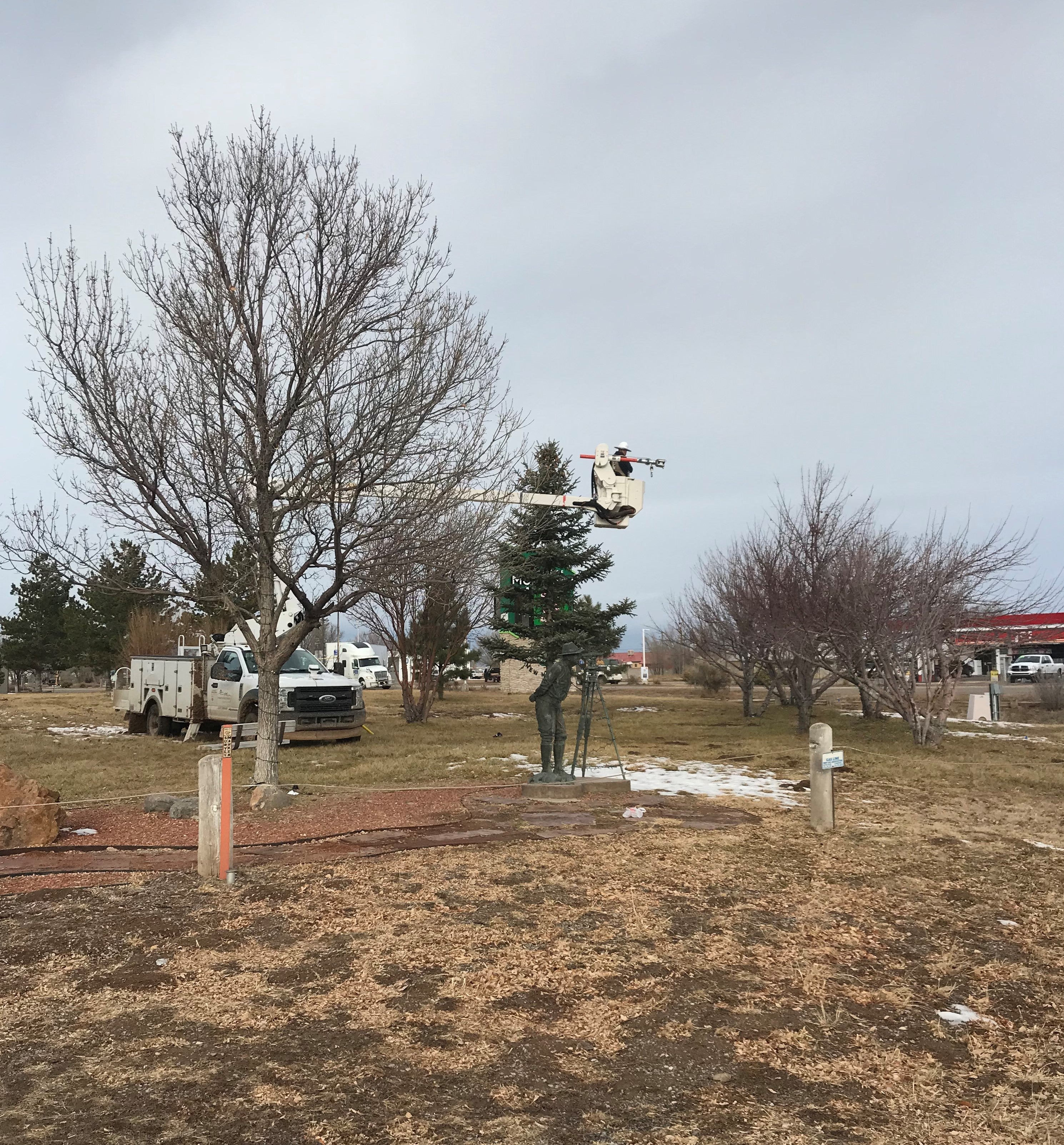 Linemen putting up Lights at Moriarty Park Central New Mexico