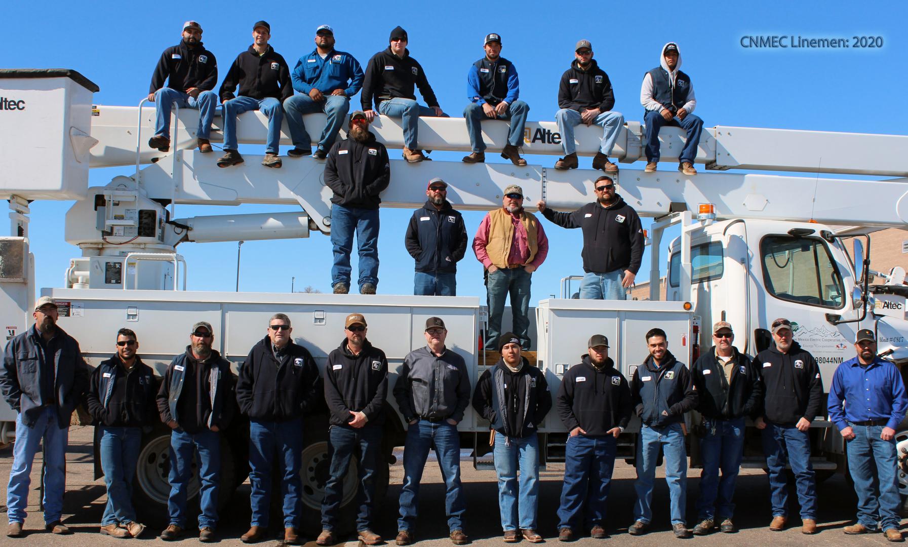 CNMEC Employees on truck